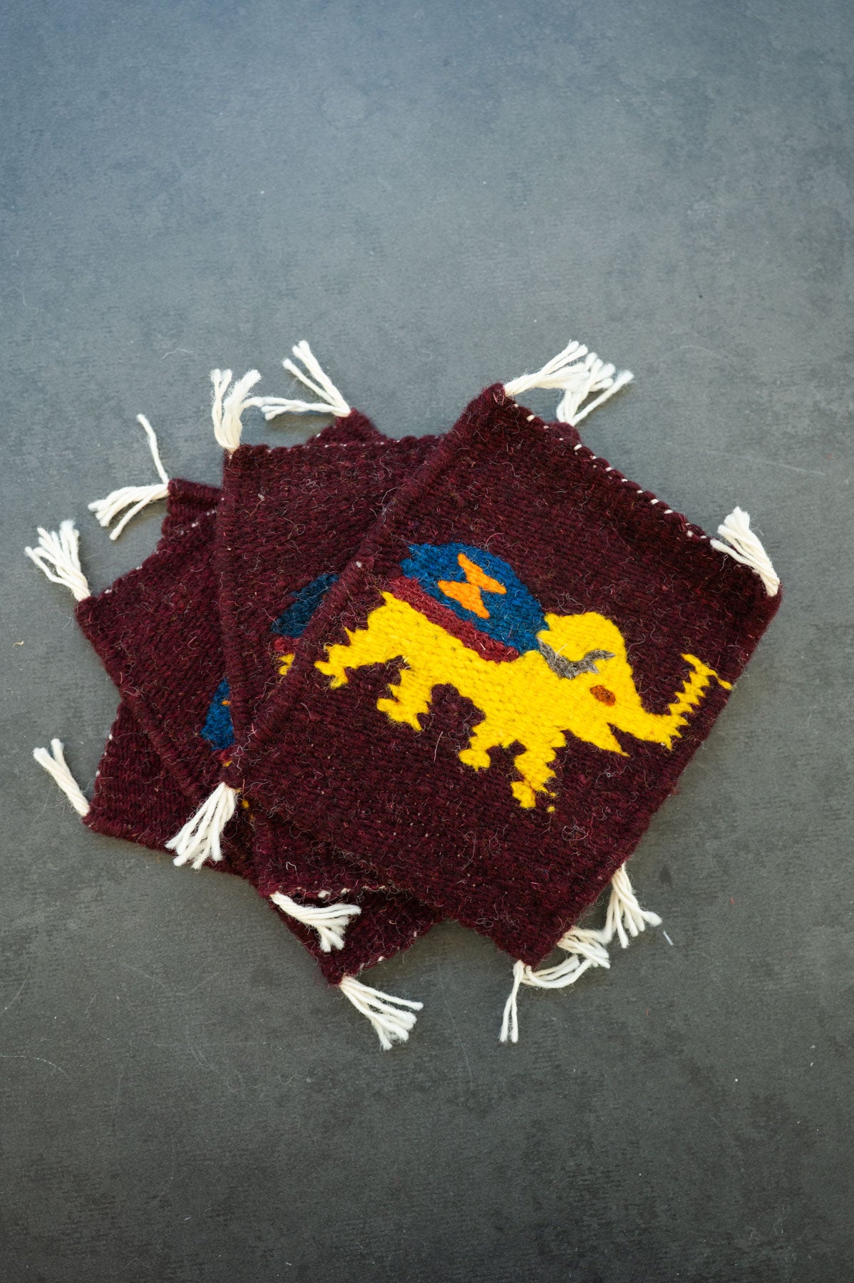 Handwoven wool coaster from Teotitlan Del Valle of an elephant