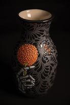 Day of the dead talavera vase featuring monarch and skeleton hand holding a marigold