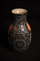 Day of the dead talavera vase featuring monarch and skeleton hand holding a marigold