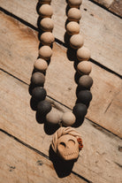 Barro negro catrina necklace on wooden background