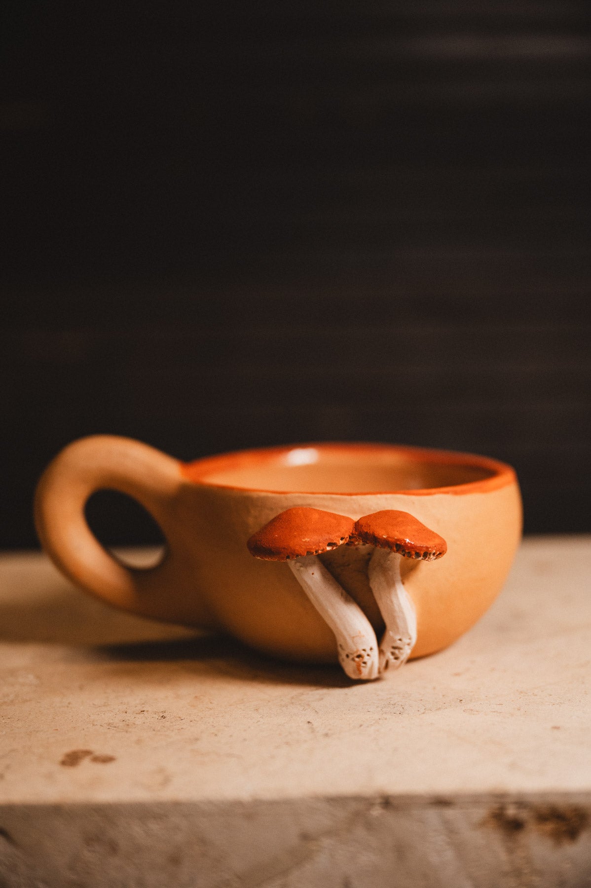 clay mushroom coffee mug on white counter