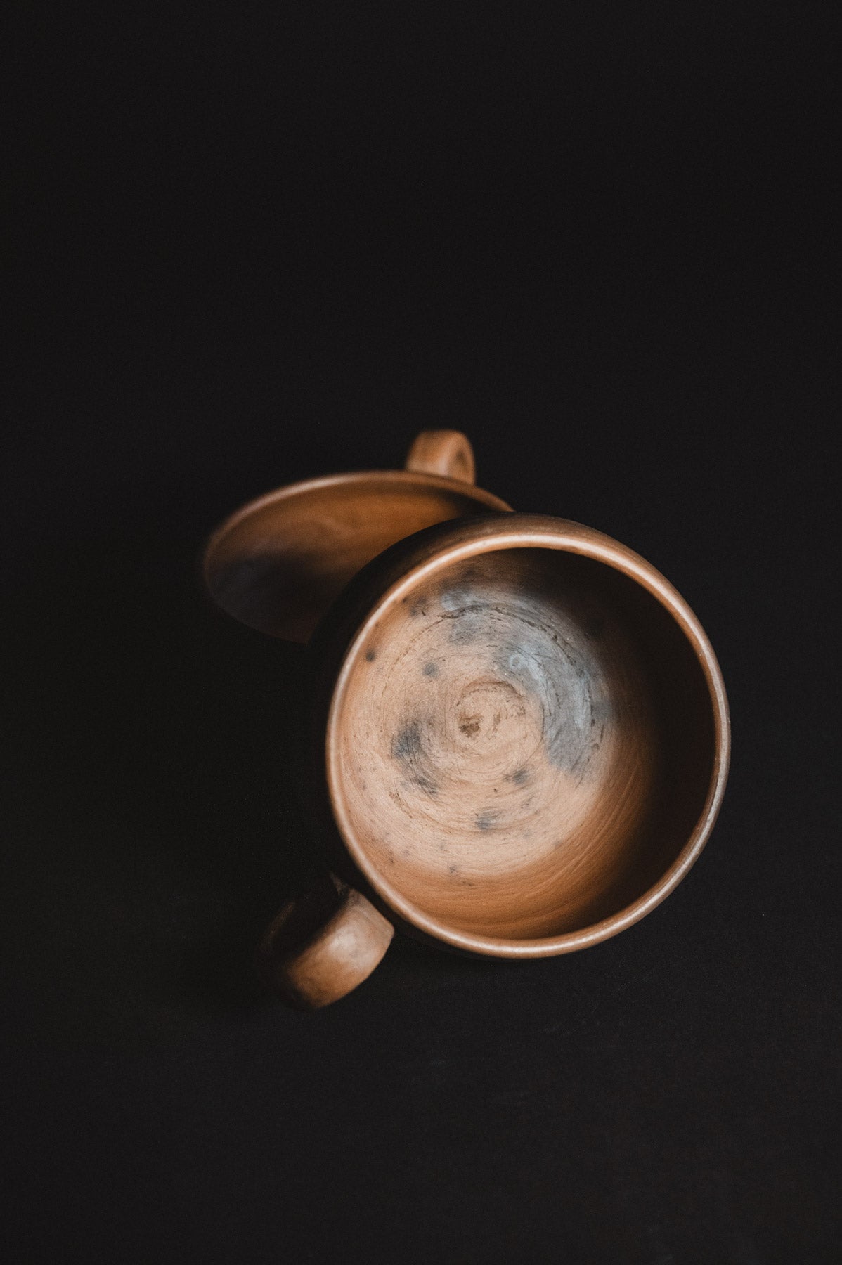Ceramic mug with a textured interior on a black background