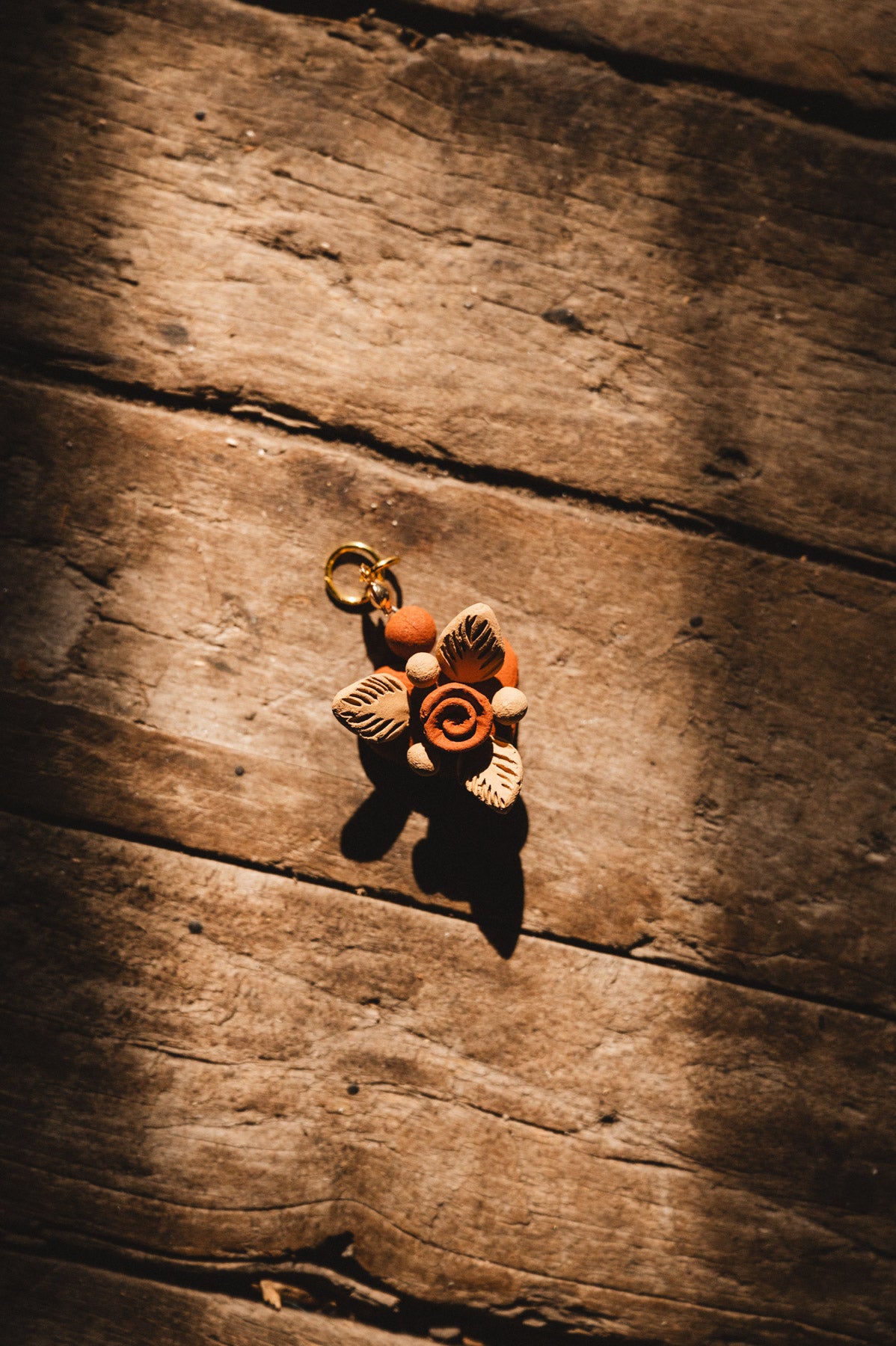 Filigrana Heart Pendant on wooden floor