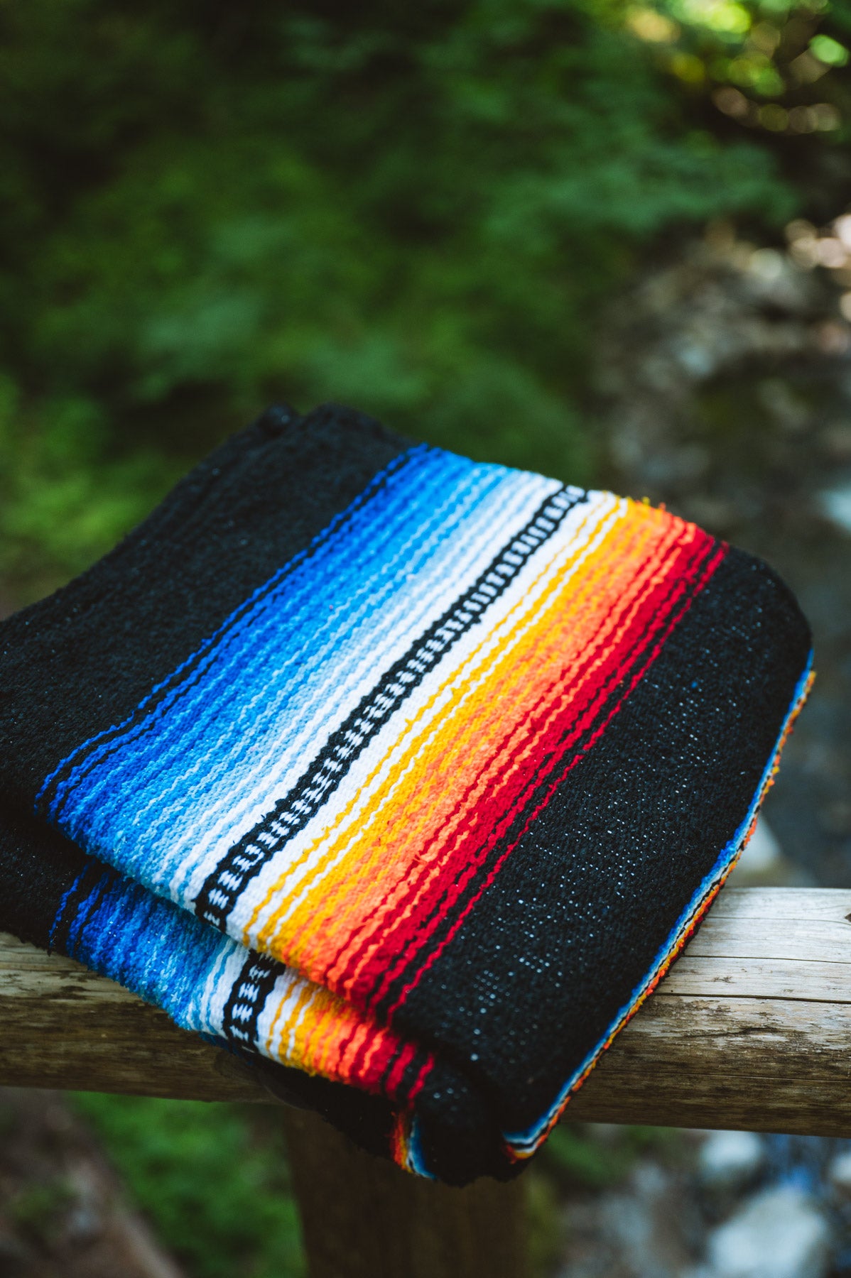 Saltillo Style Handwoven Mexican Blanket for pets folded on fence