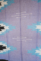 Handwoven Mexican Blanket Lavender Relampago pattern in modern industrial setting