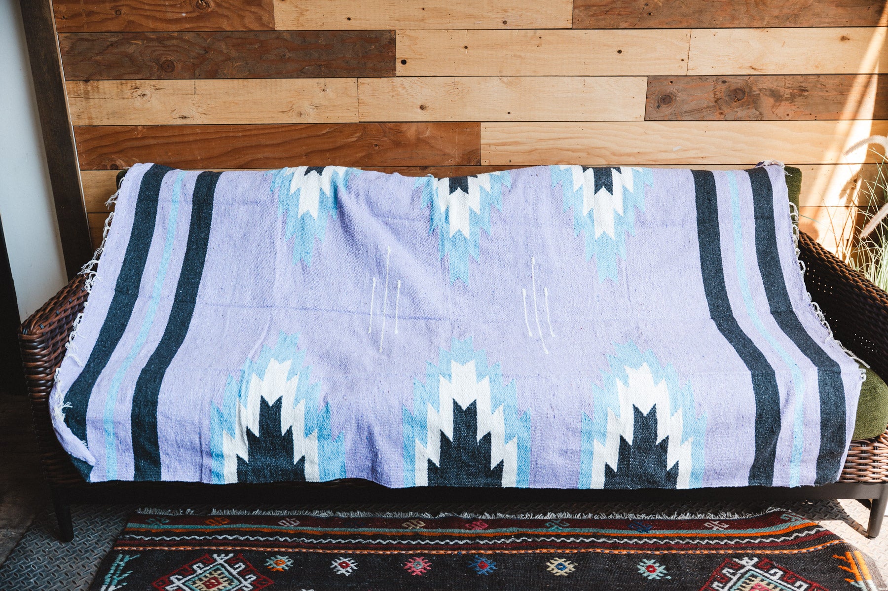 Handwoven Mexican Blanket Lavender Relampago pattern in modern industrial setting
