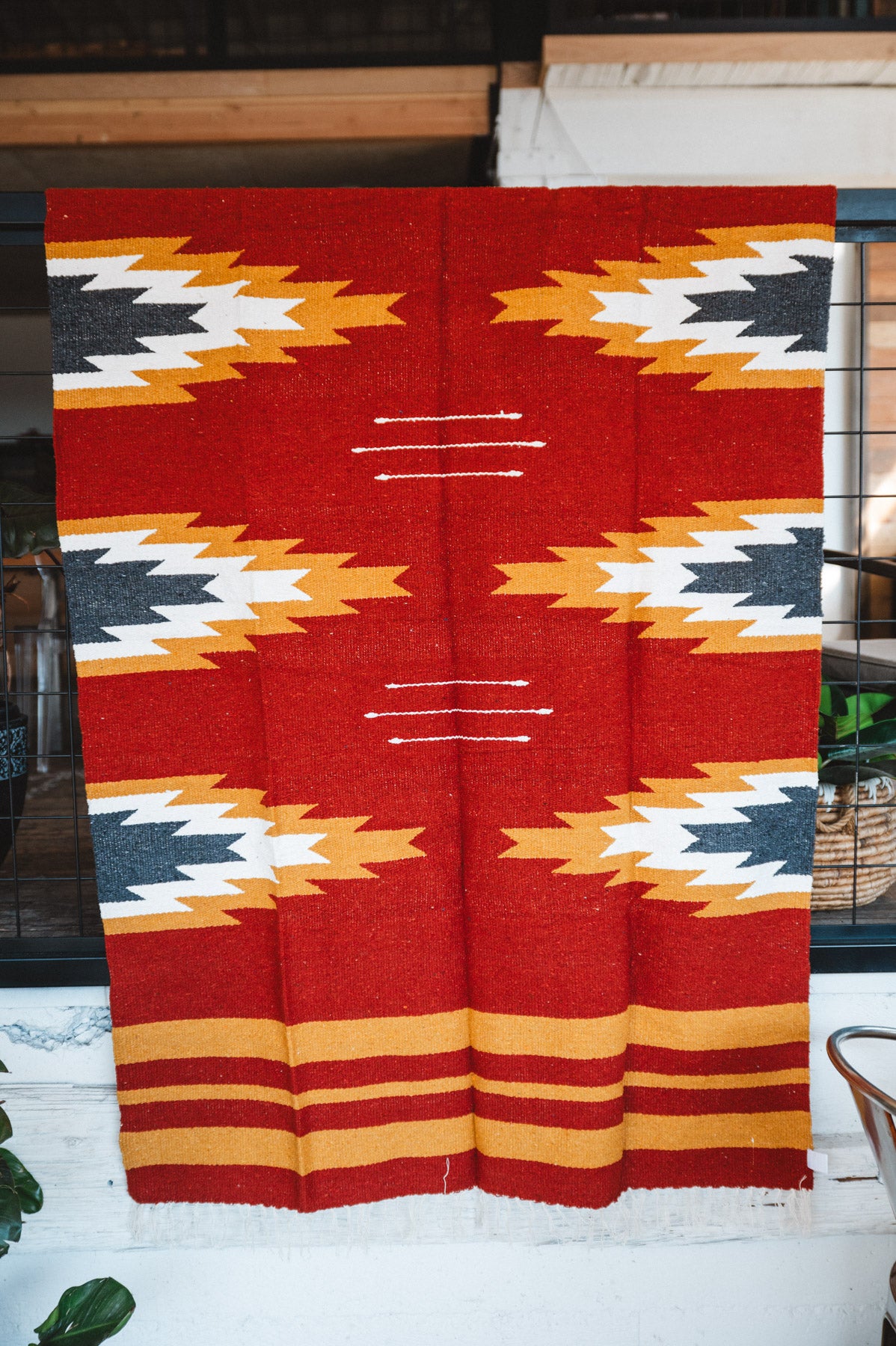 Handwoven Mexican Blanket Relampago pattern in modern industrial setting