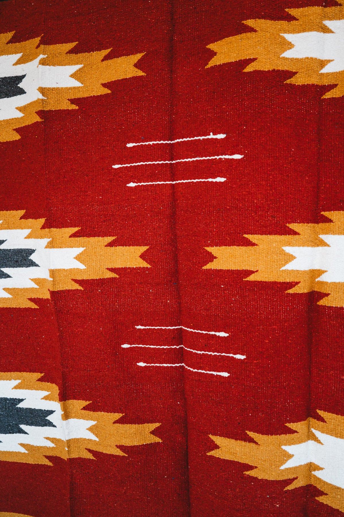 Handwoven Mexican Blanket Relampago pattern in modern industrial setting