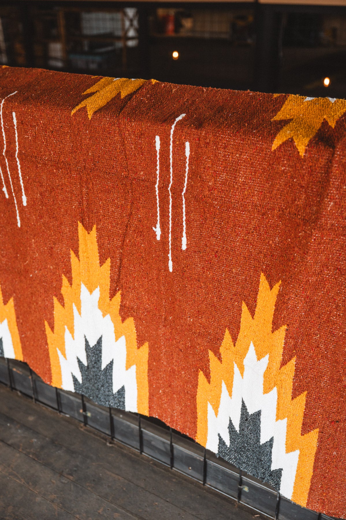 Textile with geometric pattern on a wooden surface