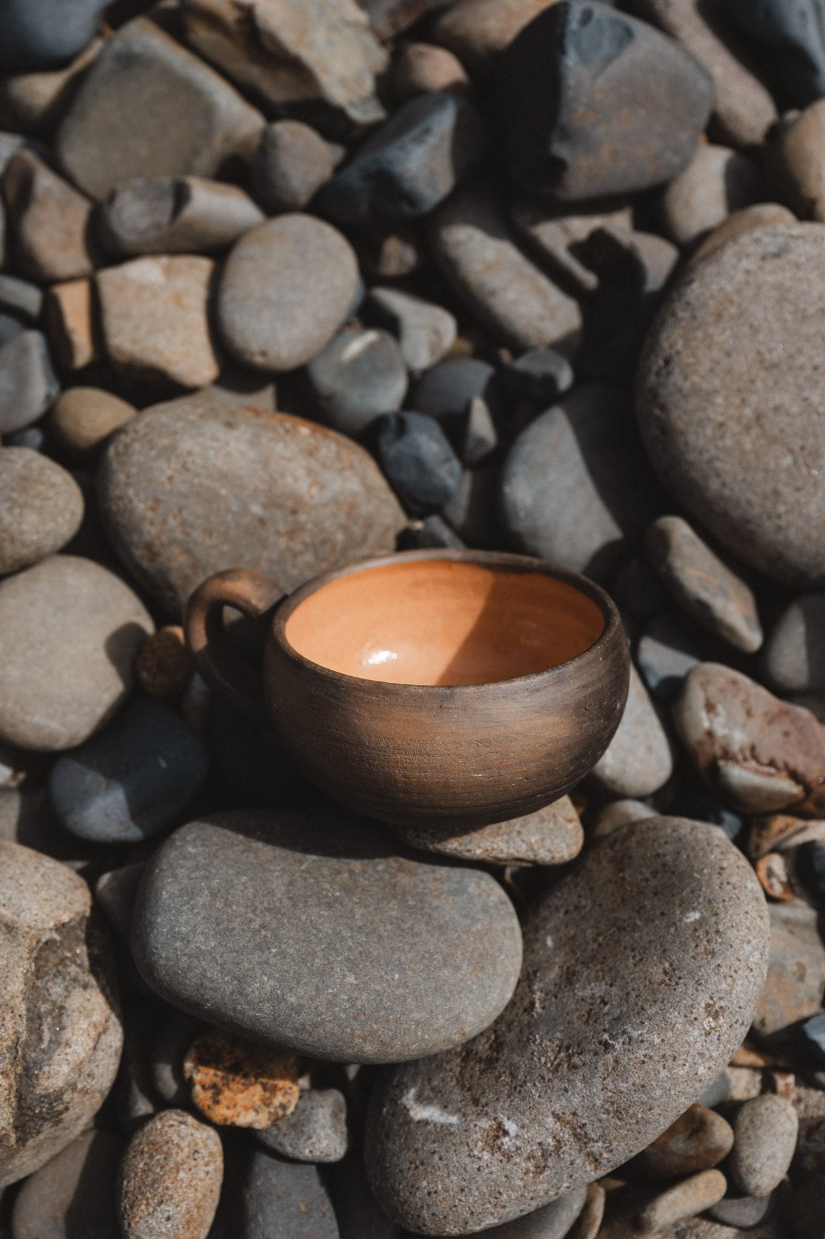 rustic oaxacan coffee cup on rocks