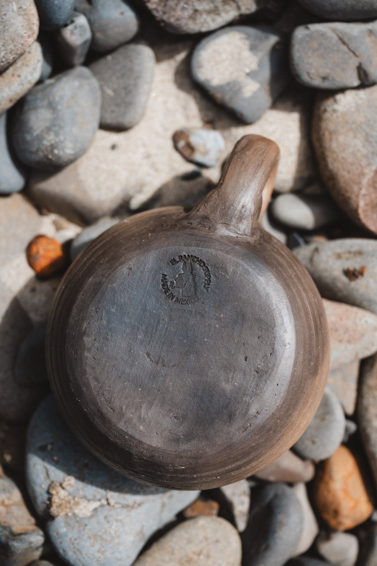 rustic oaxacan coffee mug on rocks