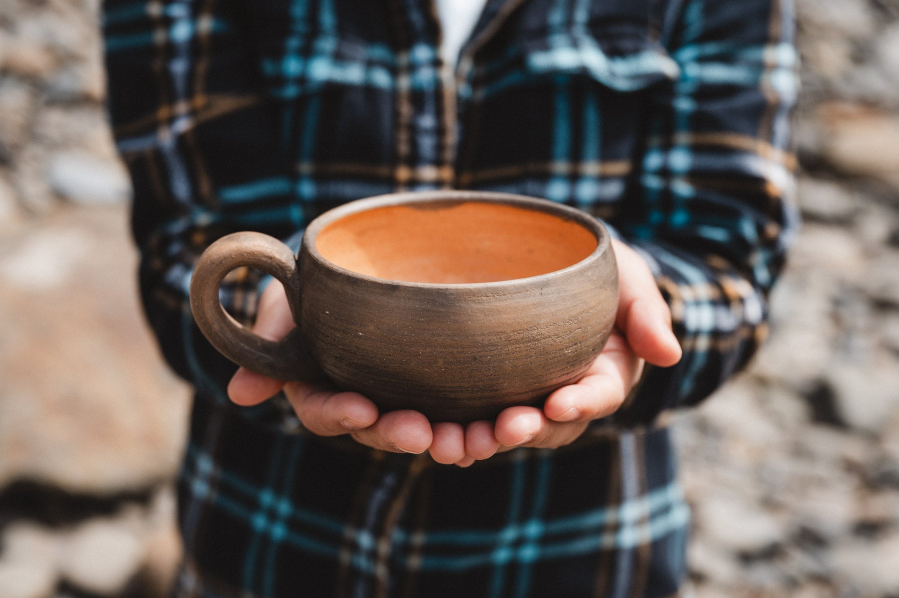 Oaxacan coffee cup held in hands