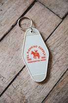 Retro Motel Keychain on wooden Floor