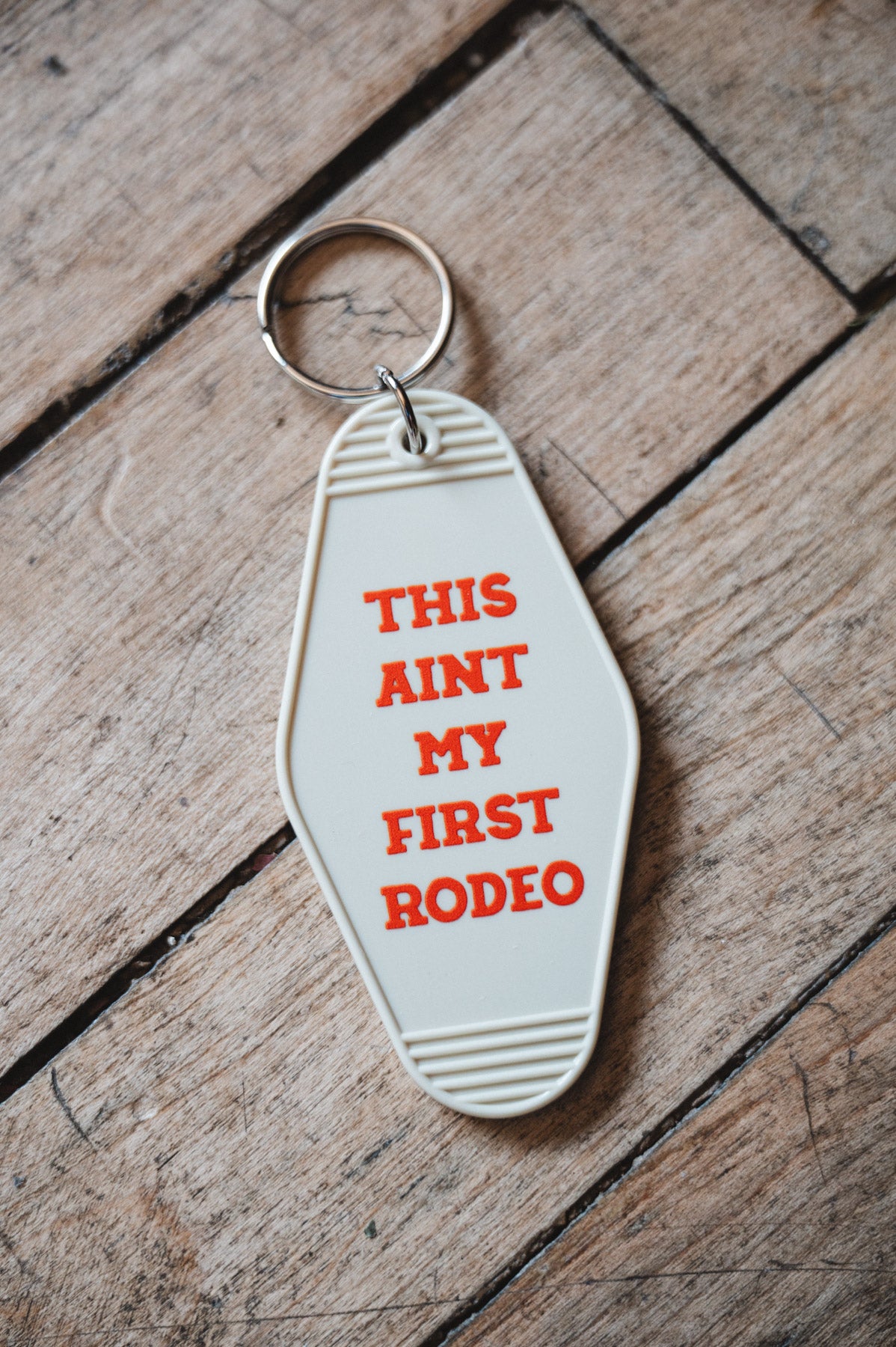 Retro Motel Keychain on wooden Floor