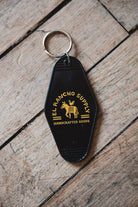 Retro Motel Keychain on wooden Floor